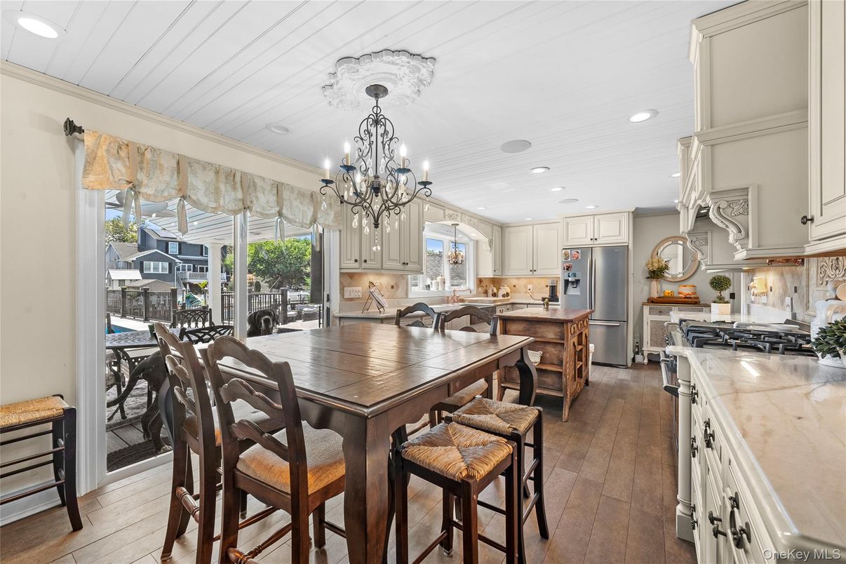 Chandelier, Dining room, Interior, Kitchen, Recessed Lighting, Stainless Steel Appliances, Wood Texture Flooring