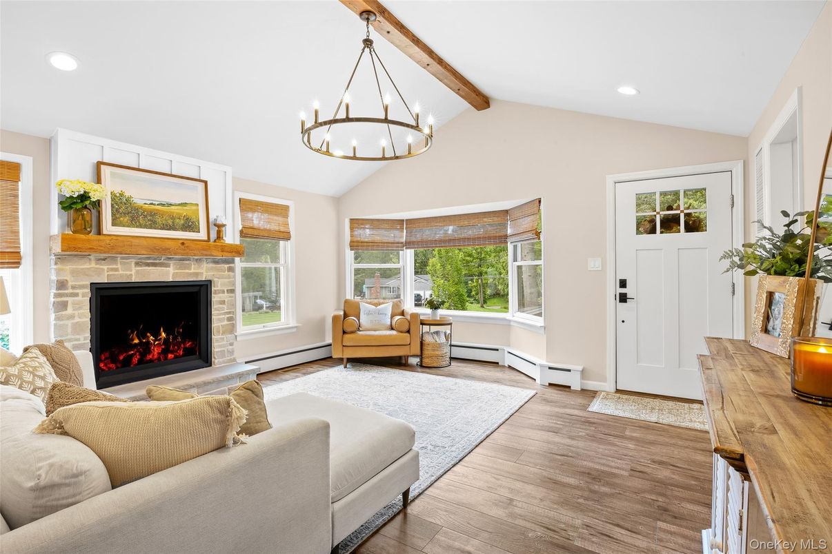 Chandelier, Fireplace, Interior, Living room, Pendant Lights, Recessed Lighting, Wooden Beams, Wood Texture Flooring