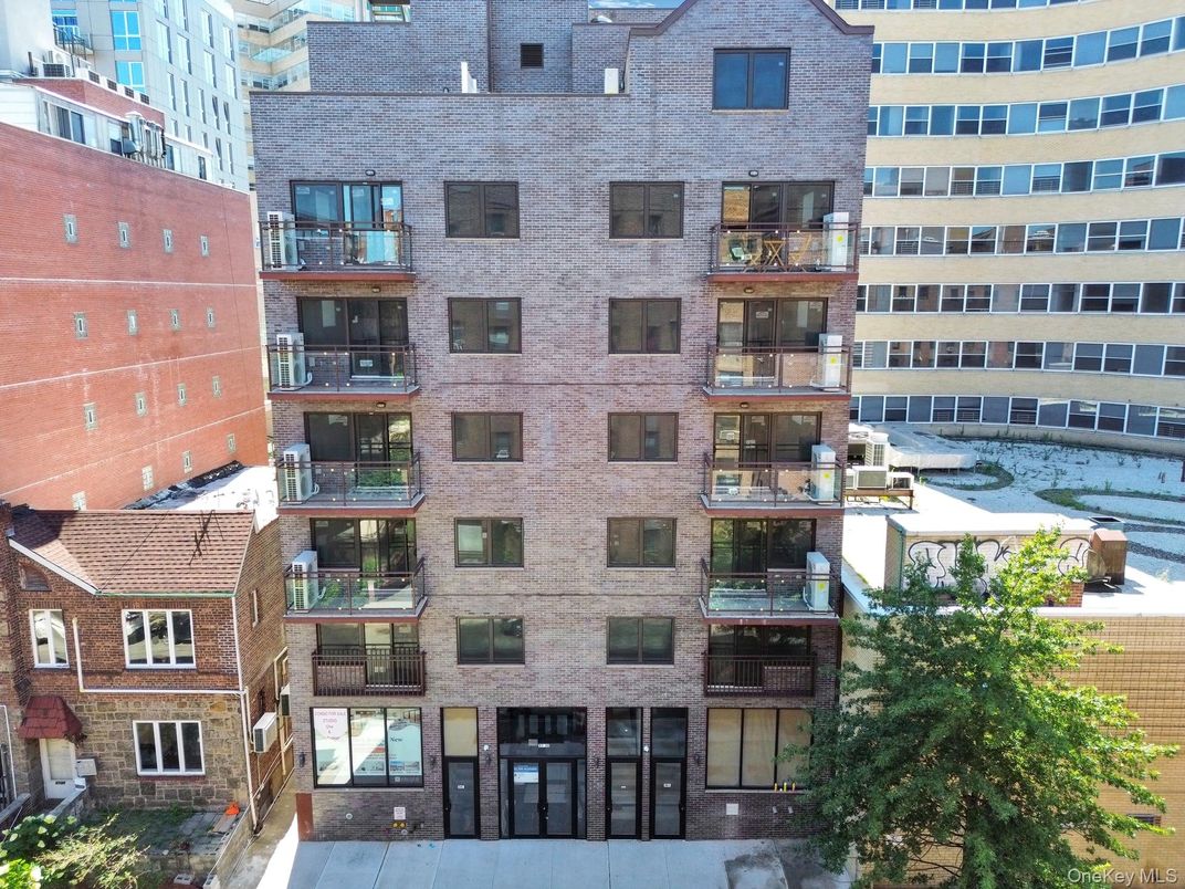 Exterior, Facade, Brick Facade, Condo Building