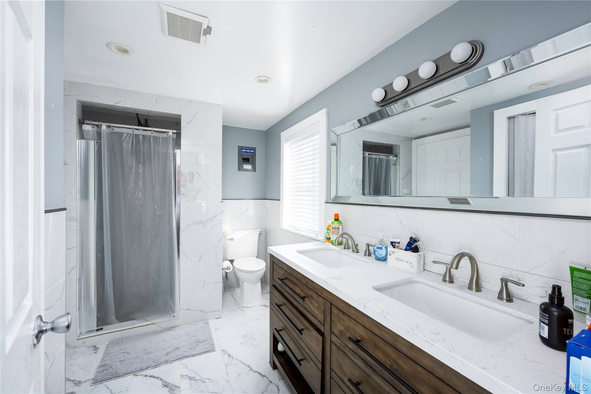 Bathroom, Dual Sink Vanities, Interior, Marble, Marble Walls, Recessed Lighting