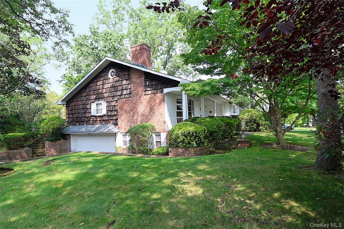 Attached, Backyard, Exterior, Facade, Brick Facade, Tudor Revival