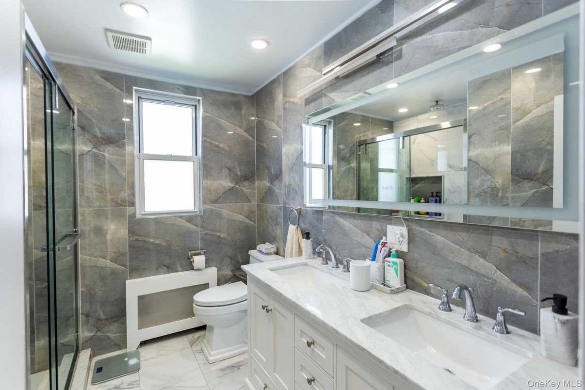 Bathroom, Dual Sink Vanities, Glass Shower, Interior, Marble, Recessed Lighting