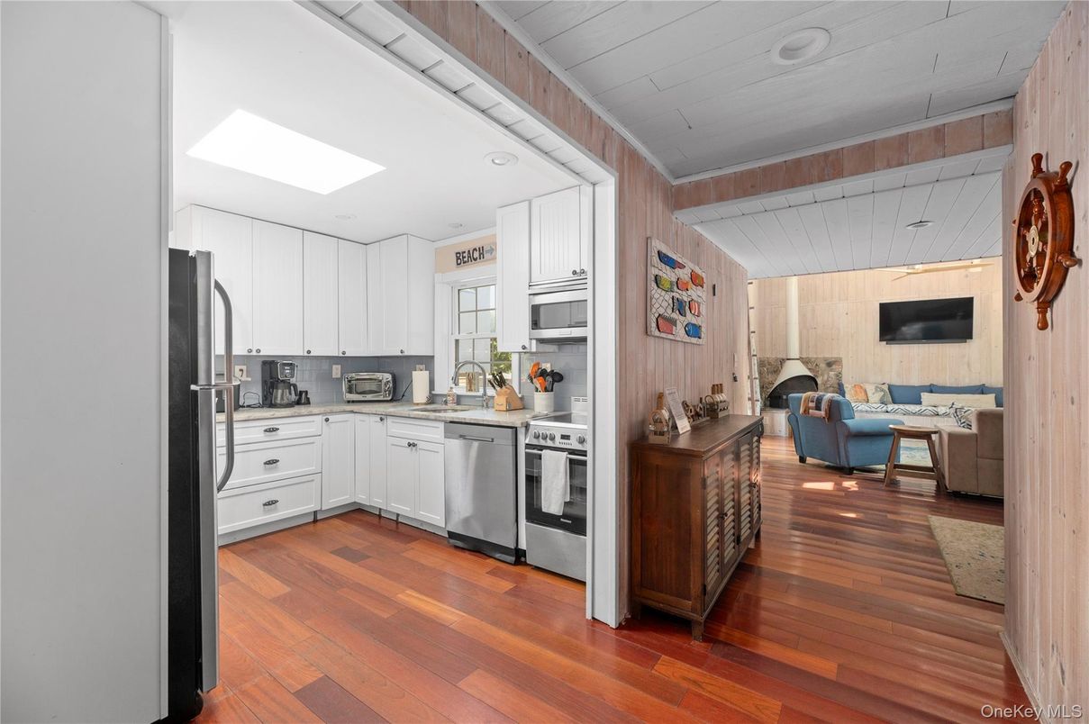 Fireplace, Interior, Kitchen, Living room, Recessed Lighting, Stainless Steel Appliances, Wood Texture Flooring