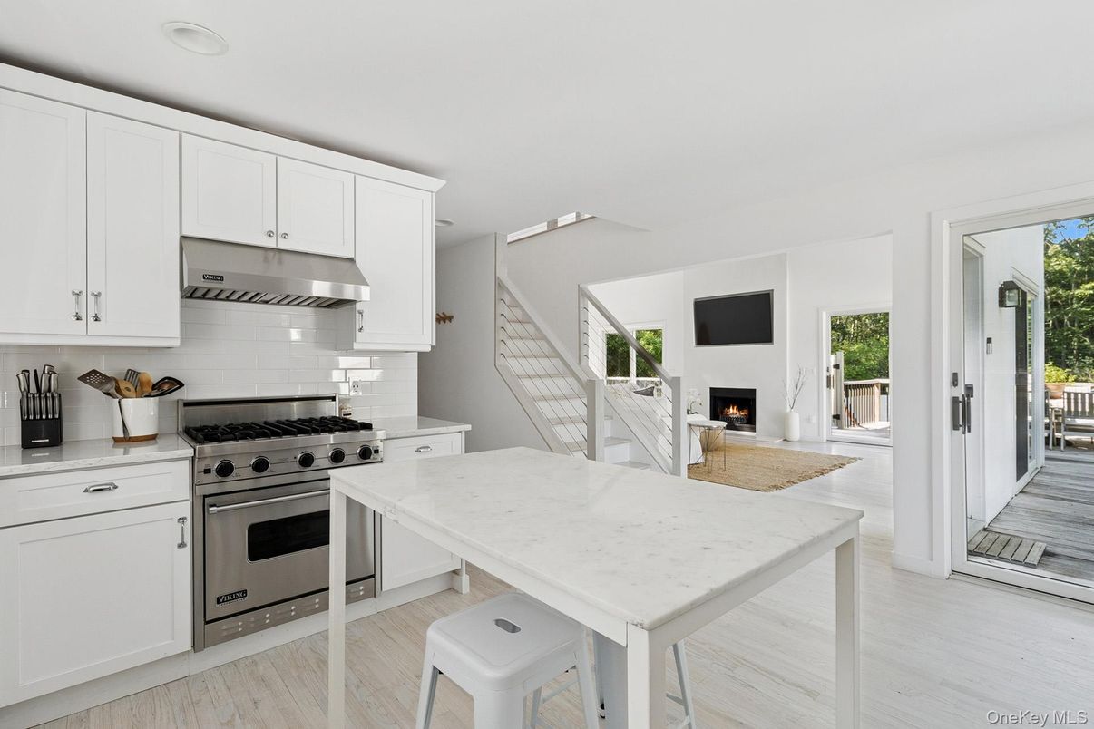 Fireplace, Interior, Kitchen, Recessed Lighting, Stainless Steel Appliances, Wood Texture Flooring