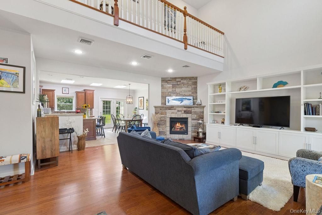 Dining room, Fireplace, Interior, Living room, Pendant Lights, Recessed Lighting, Stone Walls, Wood Texture Flooring