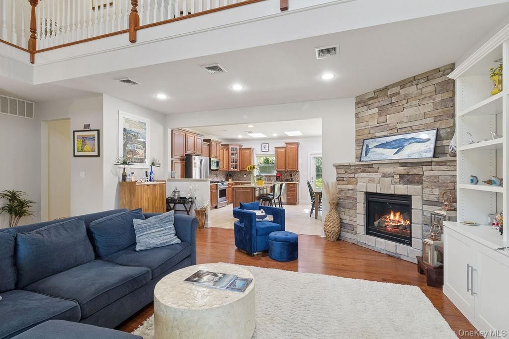 Fireplace, Interior, Kitchen, Living room, Recessed Lighting, Stone Walls, Wood Texture Flooring