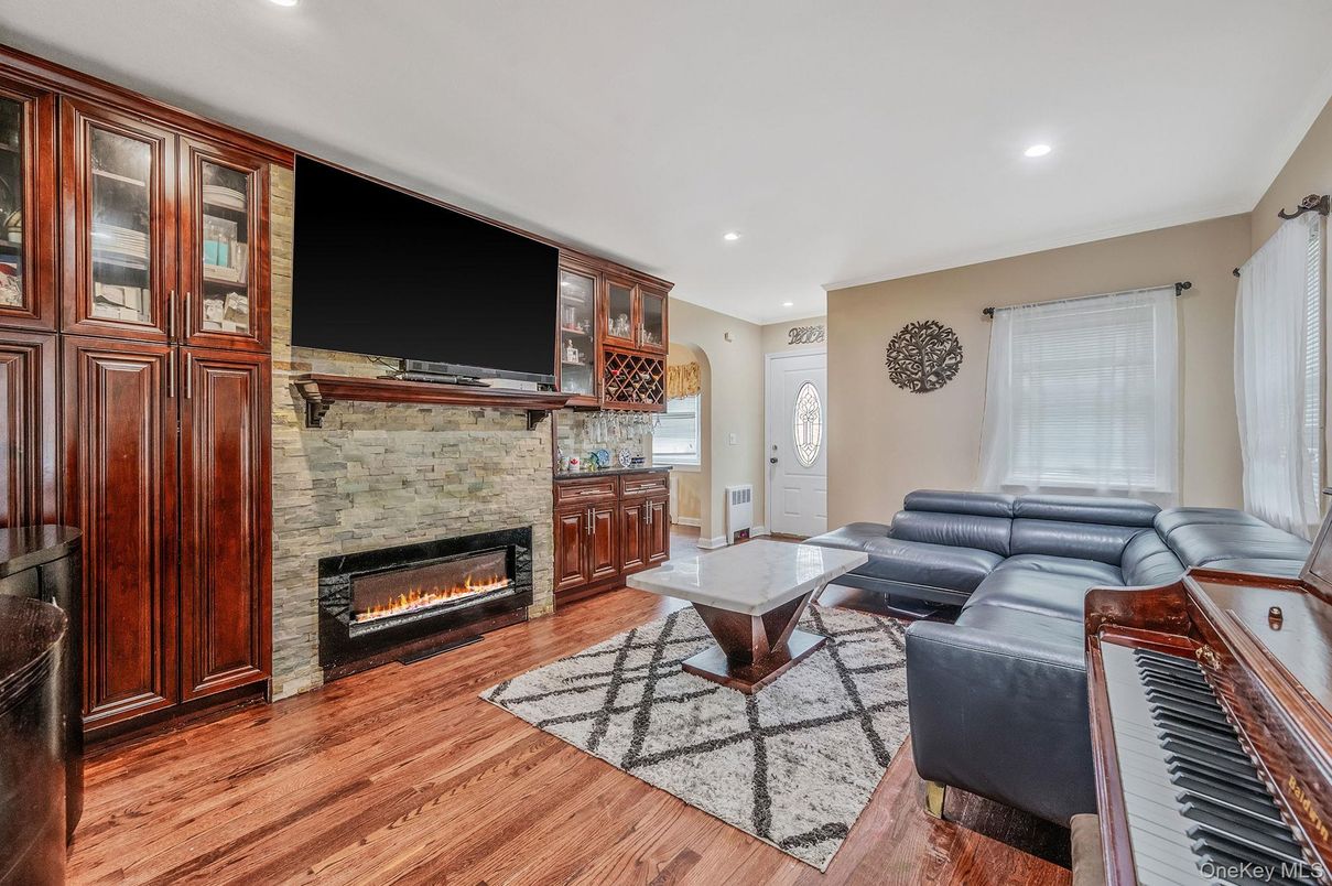 Fireplace, Interior, Living room, Piano, Recessed Lighting, Wood Texture Flooring