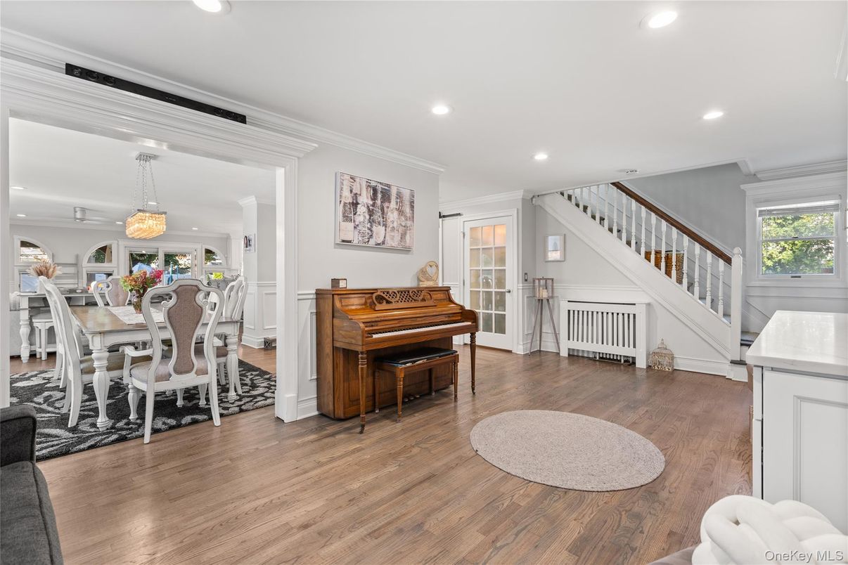 Chandelier, Dining room, Interior, Pendant Lights, Piano, Recessed Lighting, Wood Texture Flooring