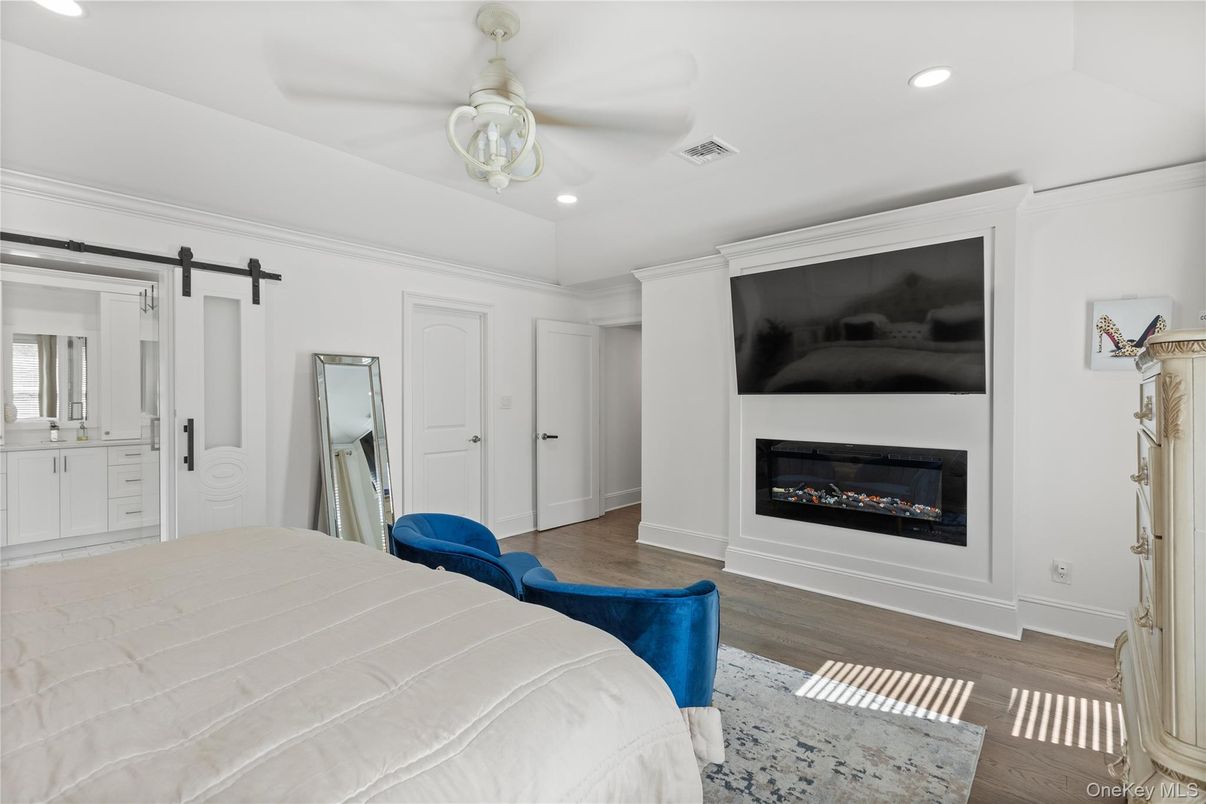 Bedroom, Fireplace, Interior, Recessed Lighting, Wood Texture Flooring