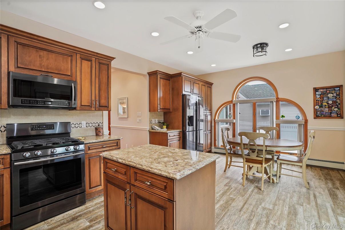 Dining room, Interior, Kitchen, Recessed Lighting, Stainless Steel Appliances, Wood Texture Flooring