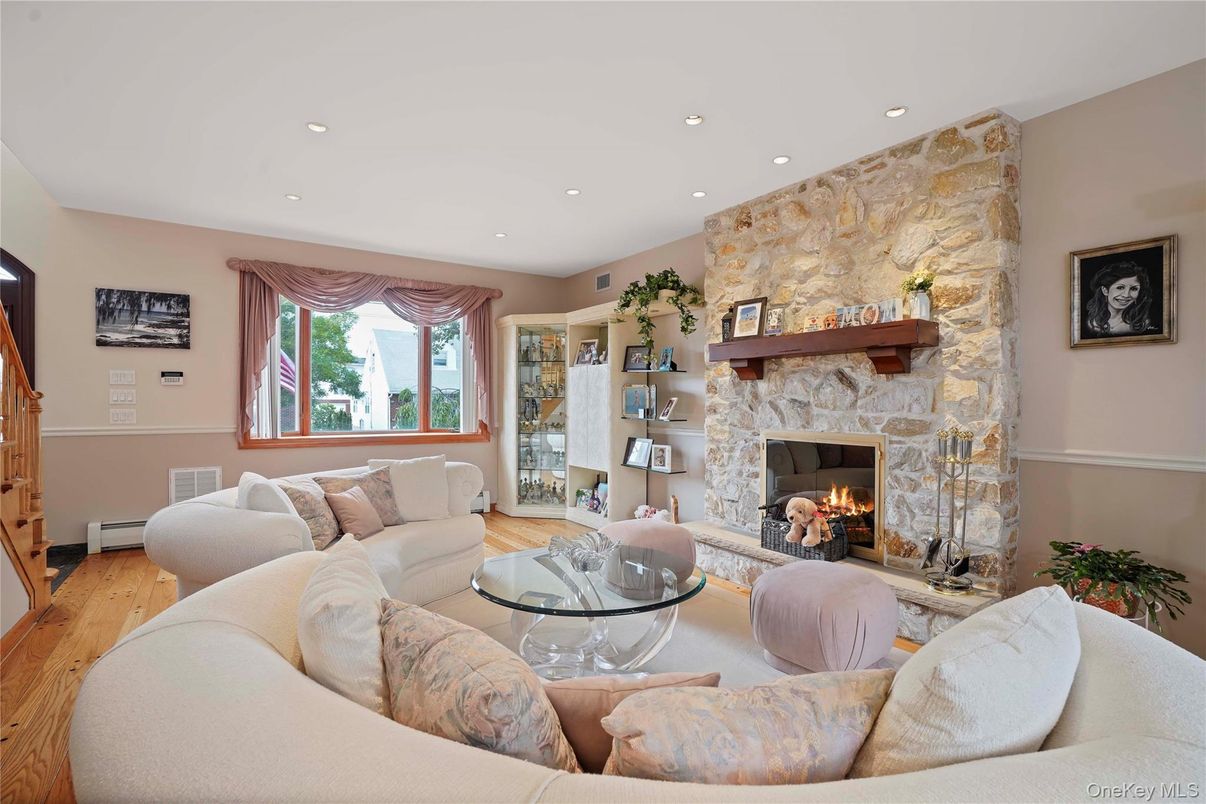 Fireplace, Interior, Living room, Recessed Lighting, Stone Walls, Wood Texture Flooring