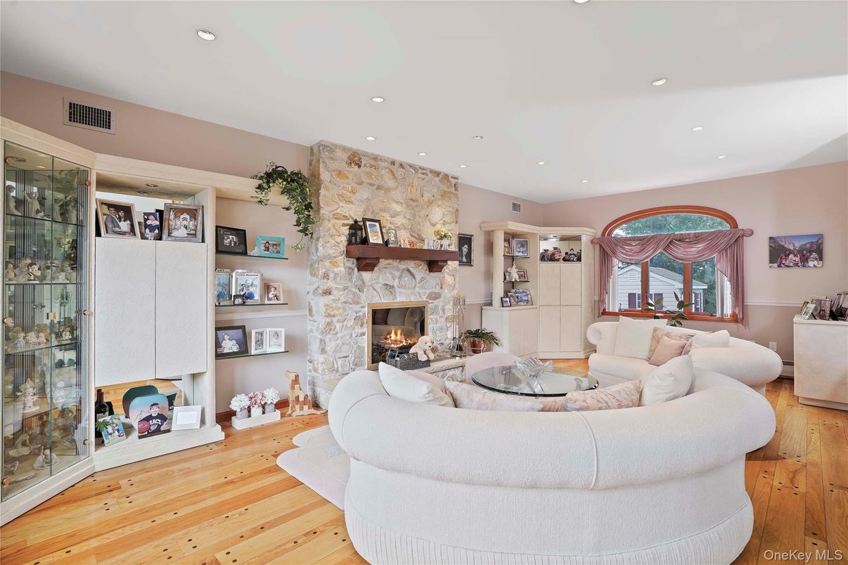 Fireplace, Interior, Living room, Recessed Lighting, Stone Walls, Wood Texture Flooring
