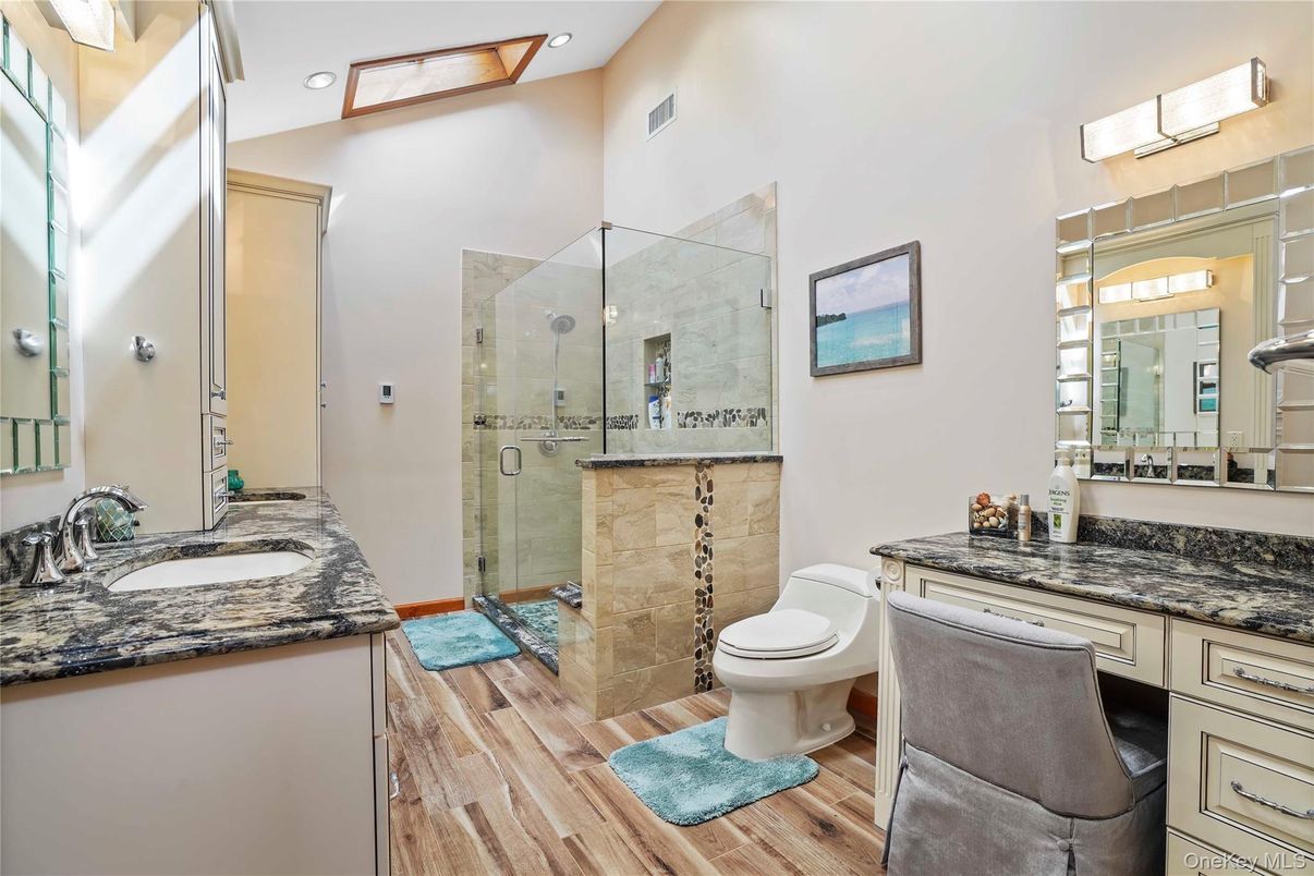 Bathroom, Dual Sink Vanities, Glass Shower, Interior, Recessed Lighting, Wood Texture Flooring
