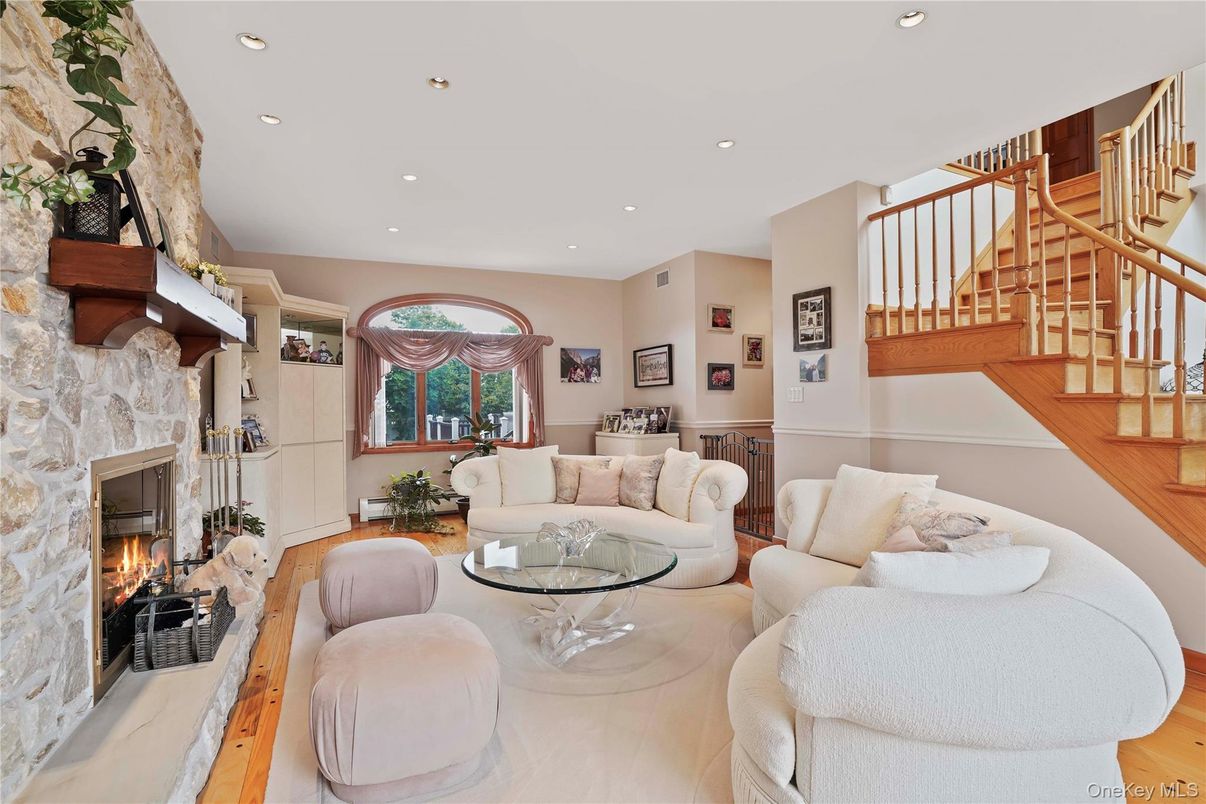 Fireplace, Interior, Living room, Recessed Lighting, Stone Walls, Wood Texture Flooring