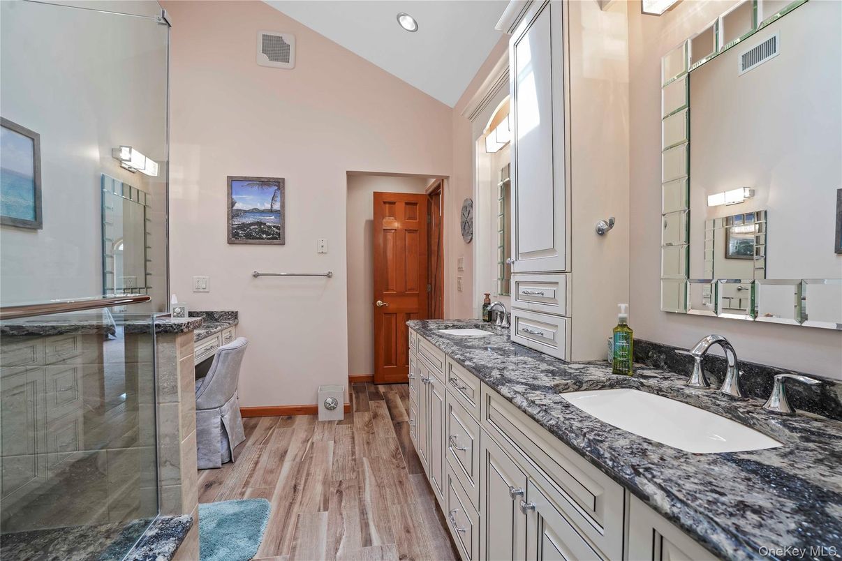 Bathroom, Dual Sink Vanities, Glass Shower, Interior, Recessed Lighting, Wood Texture Flooring