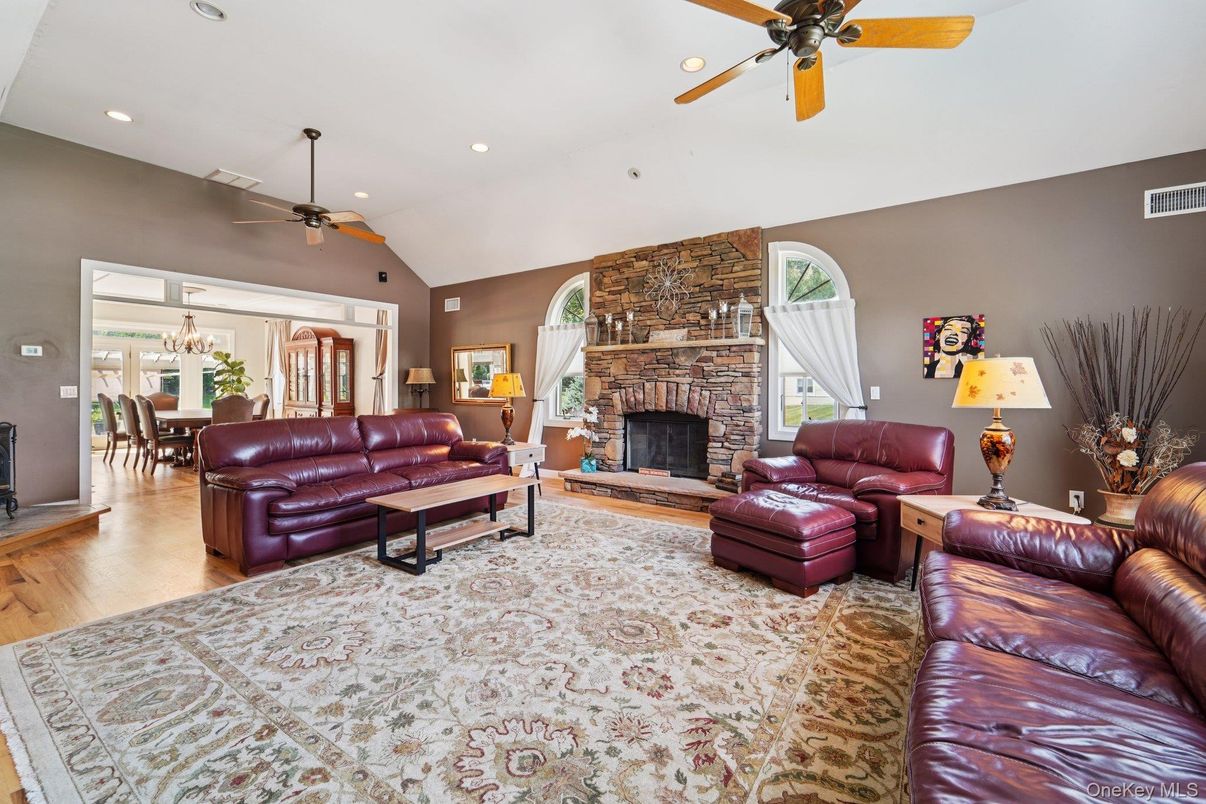 Chandelier, Dining room, Fireplace, Interior, Living room, Recessed Lighting, Stone Walls, Wood Texture Flooring