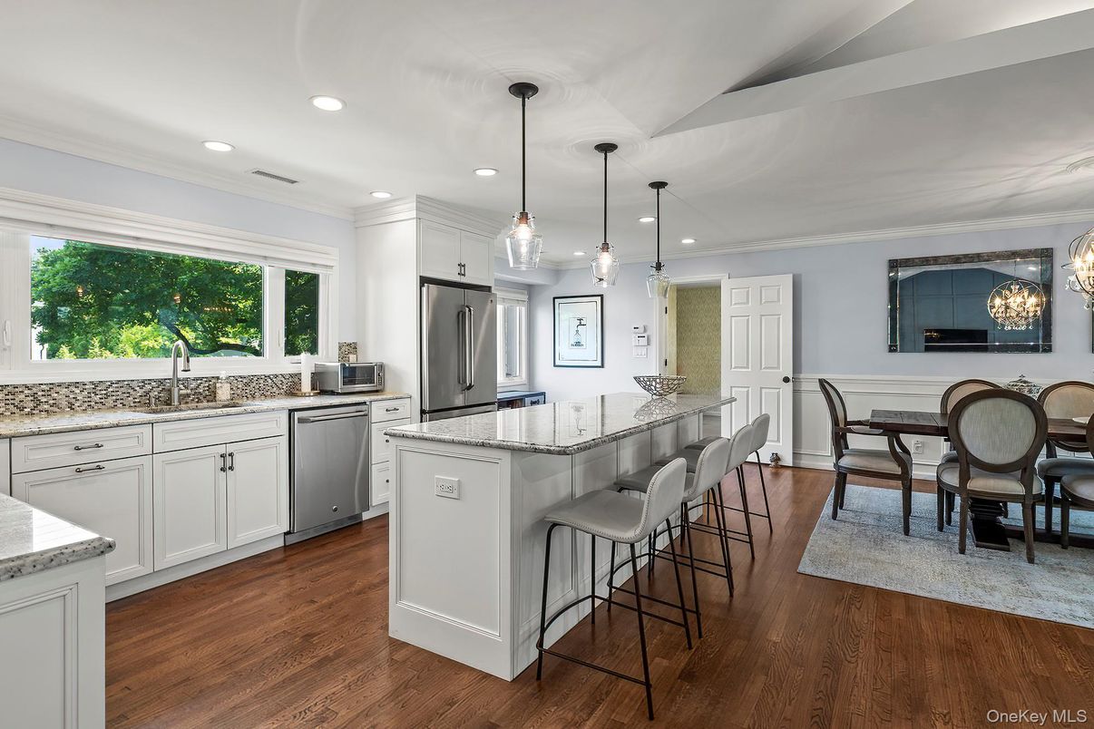 Dining room, Interior, Kitchen, Pendant Lights, Recessed Lighting, Stainless Steel Appliances, Wood Texture Flooring