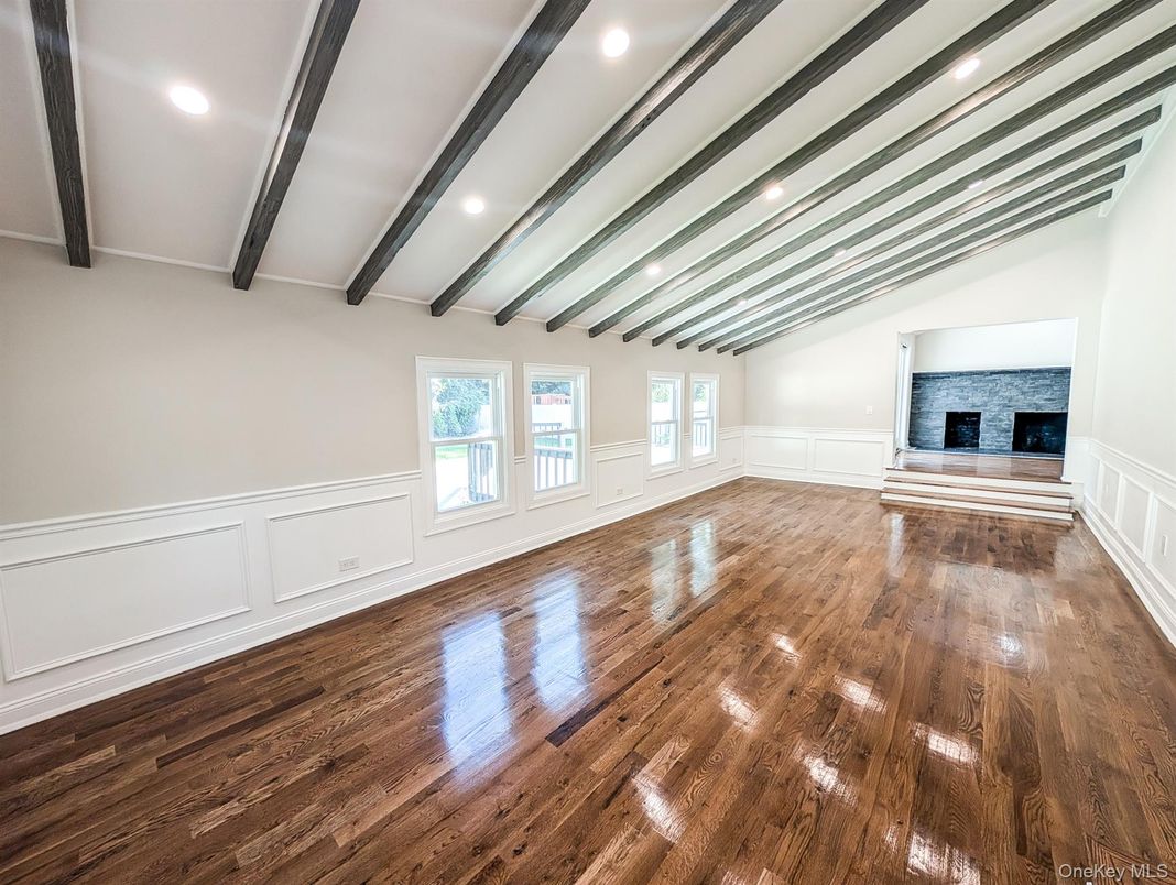 Empty room, Fireplace, Interior, Recessed Lighting, Wooden Beams, Wood Texture Flooring