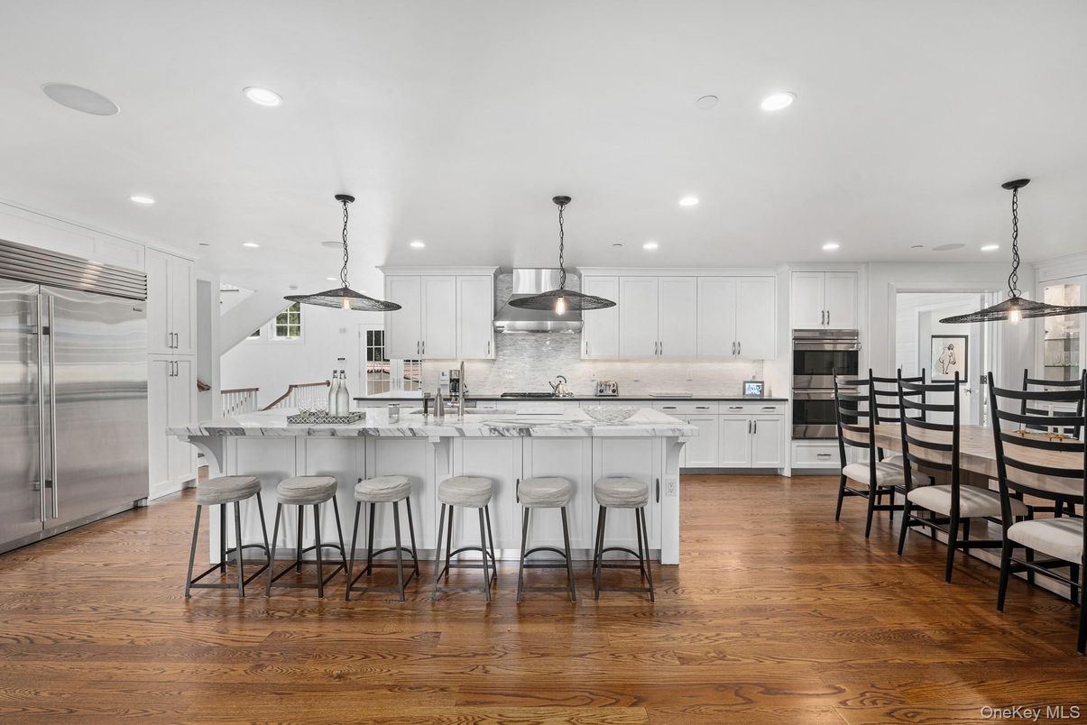 Dining room, Interior, Kitchen, Pendant Lights, Recessed Lighting, Stainless Steel Appliances, Wood Texture Flooring