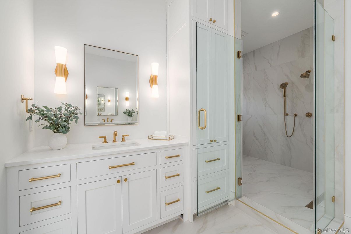 Bathroom, Dual Sink Vanities, Glass Shower, Interior, Marble, Marble Walls, Recessed Lighting
