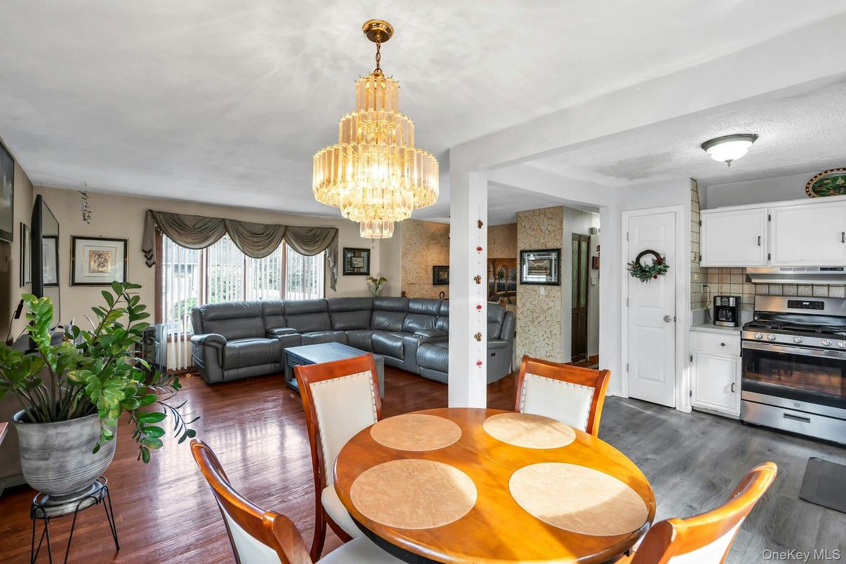 Chandelier, Dining room, Interior, Kitchen, Living room, Stainless Steel Appliances, Wood Texture Flooring