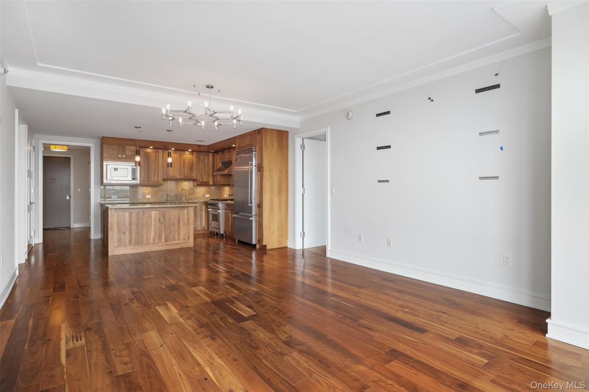 Empty room, Interior, Kitchen, Pendant Lights, Stainless Steel Appliances, Wood Texture Flooring