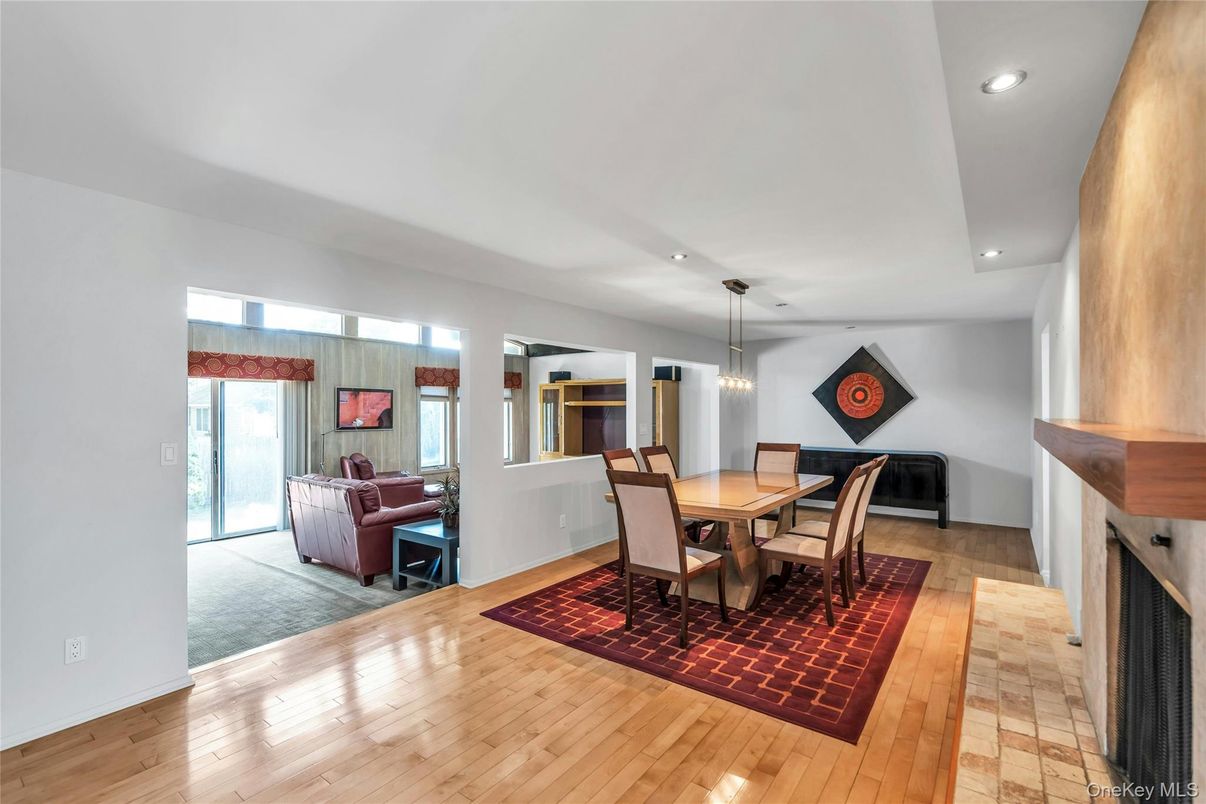 Dining room, Fireplace, Interior, Living room, Pendant Lights, Recessed Lighting, Wood Texture Flooring