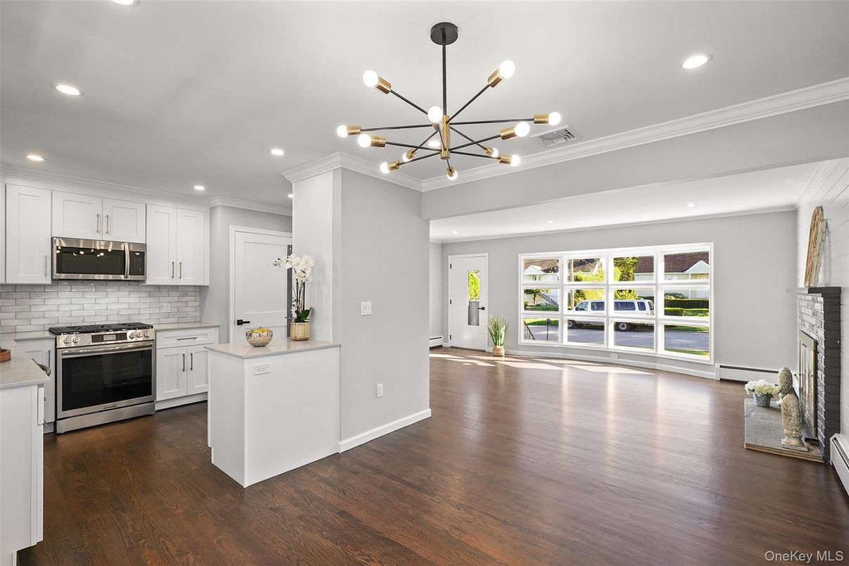 Fireplace, Interior, Kitchen, Pendant Lights, Recessed Lighting, Stainless Steel Appliances, Wood Texture Flooring