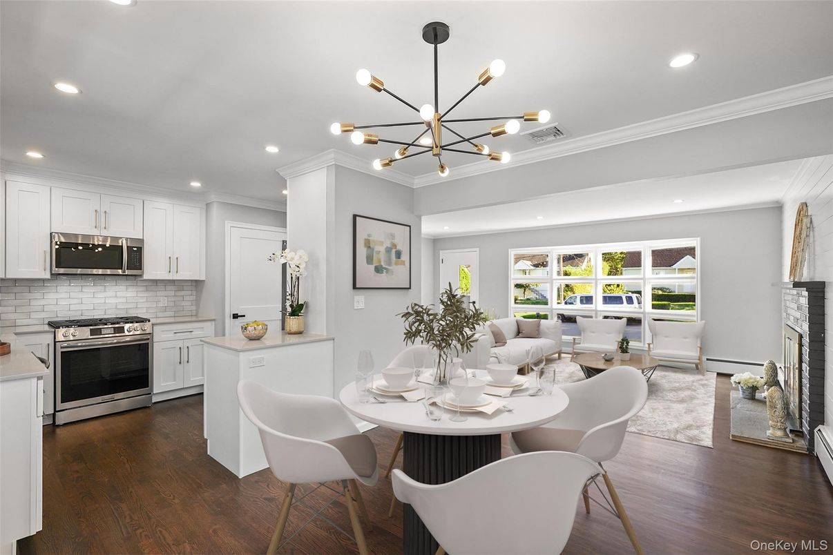 Dining room, Fireplace, Interior, Kitchen, Living room, Pendant Lights, Recessed Lighting, Stainless Steel Appliances, Wood Texture Flooring
