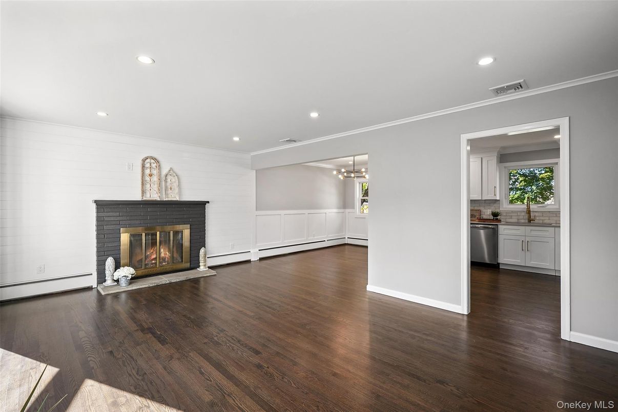 Empty room, Fireplace, Interior, Kitchen, Pendant Lights, Recessed Lighting, Wood Texture Flooring