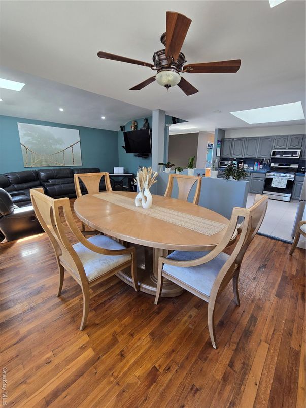 Dining room, Interior, Kitchen, Living room, Recessed Lighting, Stainless Steel Appliances, Wood Texture Flooring