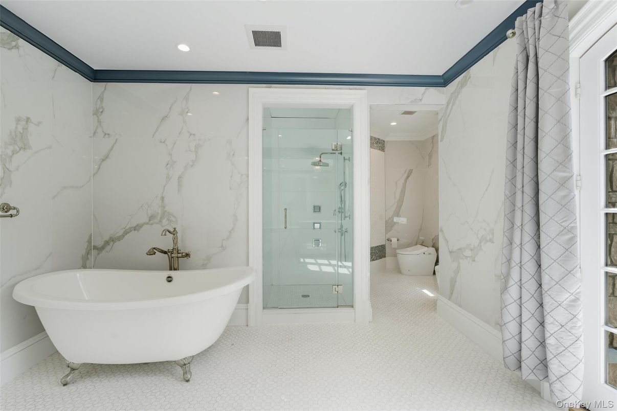 Bathroom, Free Standing Baths, Glass Shower, Interior, Marble Walls, Recessed Lighting