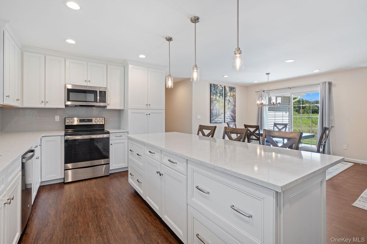 Dining room, Interior, Kitchen, Pendant Lights, Recessed Lighting, Stainless Steel Appliances, Wood Texture Flooring