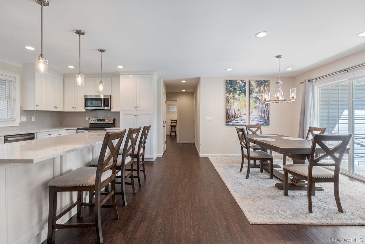 Dining room, Interior, Kitchen, Pendant Lights, Recessed Lighting, Stainless Steel Appliances, Wood Texture Flooring