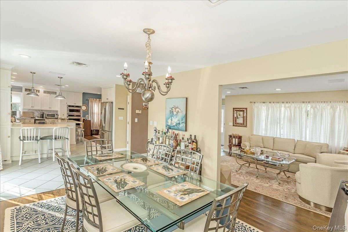 Chandelier, Dining room, Interior, Kitchen, Living room, Recessed Lighting, Stainless Steel Appliances, Wood Texture Flooring
