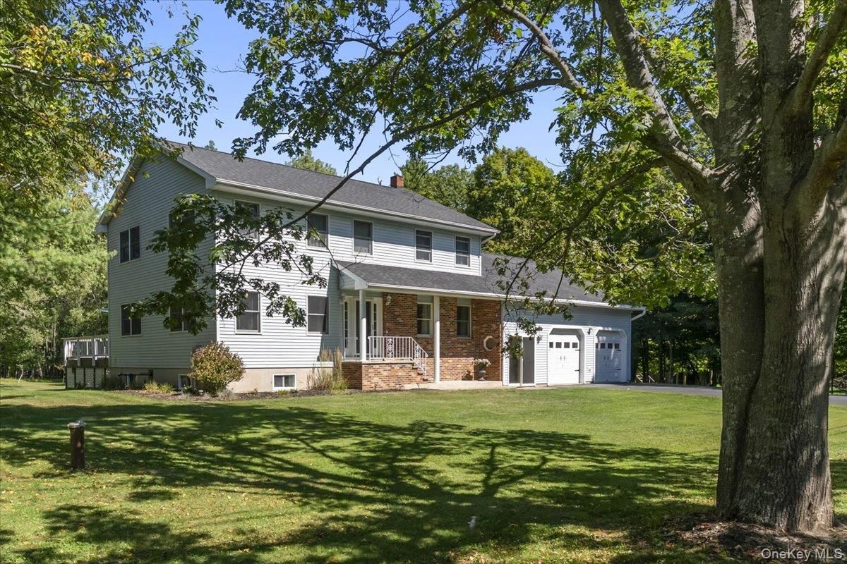 Attached, Backyard, Exterior, Facade, Brick Facade, Raised Ranch