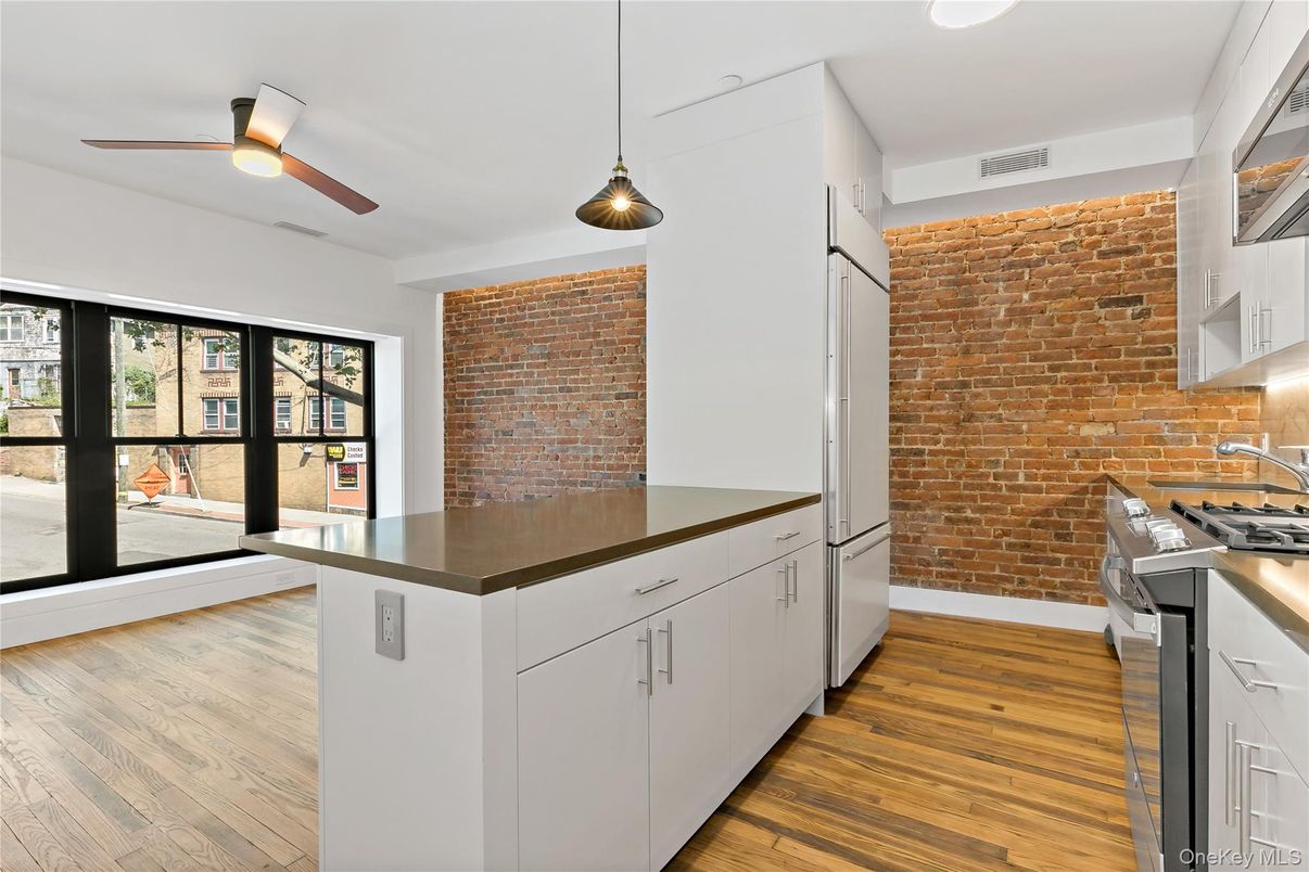 Interior, Kitchen, Pendant Lights, Recessed Lighting, Stainless Steel Appliances, Stone Walls, Wood Texture Flooring