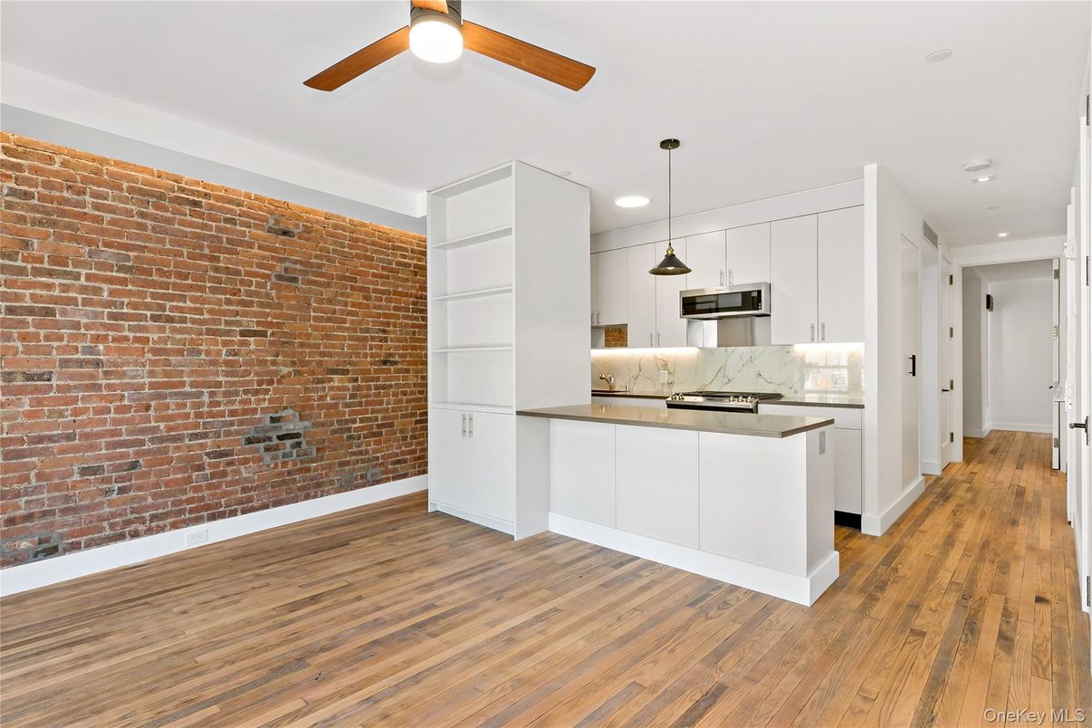 Interior, Kitchen, Pendant Lights, Recessed Lighting, Stainless Steel Appliances, Stone Walls, Wood Texture Flooring