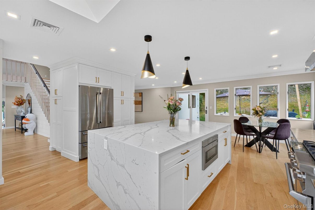 Dining room, Interior, Kitchen, Pendant Lights, Recessed Lighting, Stainless Steel Appliances, Wood Texture Flooring