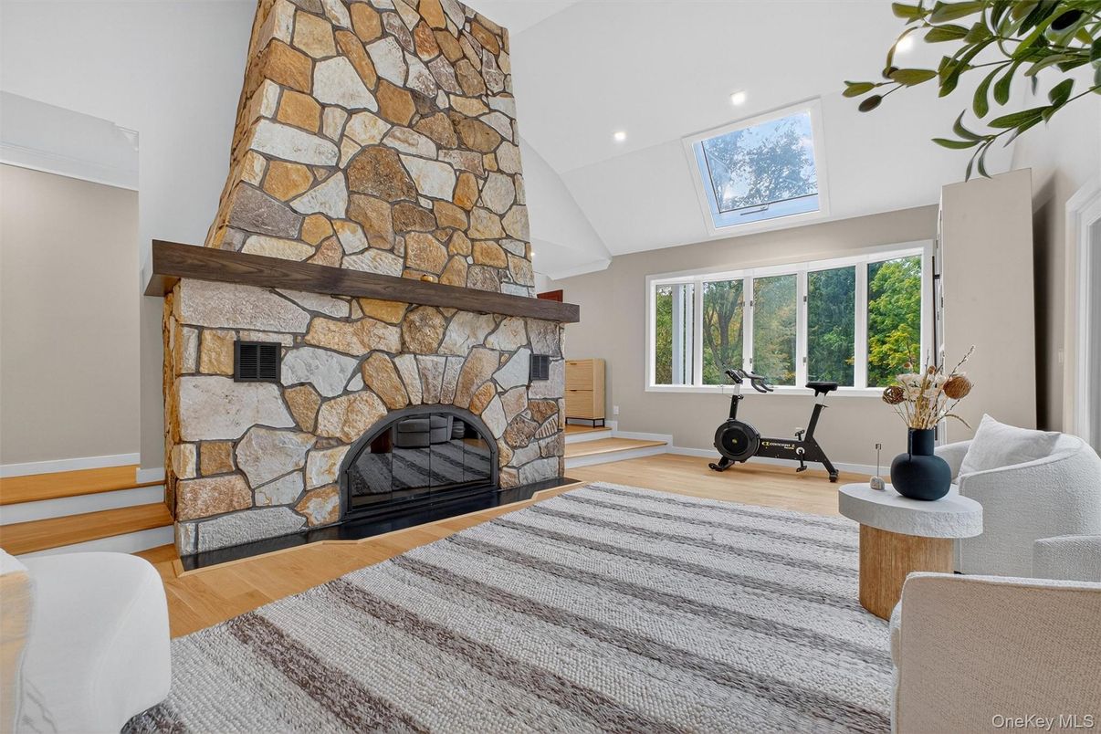 Fireplace, Fitness Equipment, Interior, Recessed Lighting, Stone Walls, Wood Texture Flooring