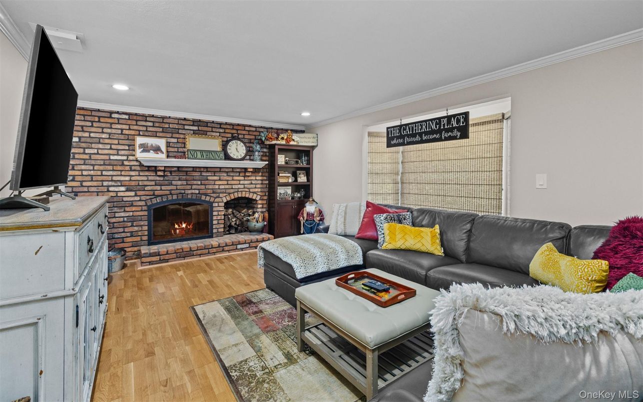 Fireplace, Interior, Living room, Recessed Lighting, Stone Walls, Wood Texture Flooring