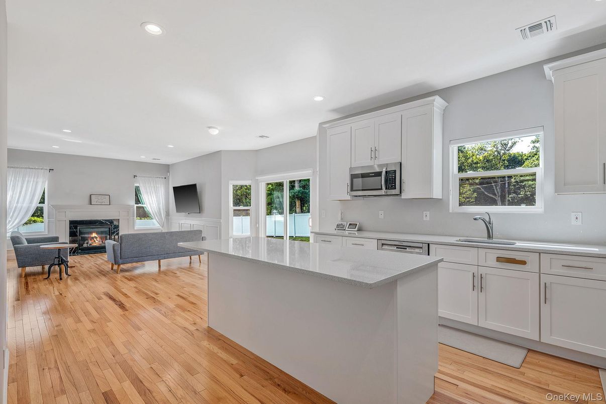 Fireplace, Interior, Kitchen, Living room, Recessed Lighting, Wood Texture Flooring