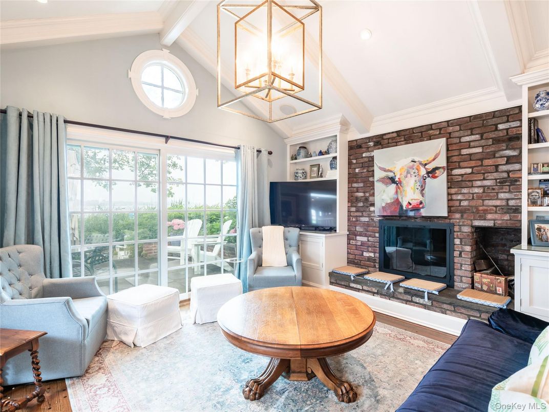 Fireplace, Interior, Living room, Recessed Lighting, Stone Walls, Wood Texture Flooring