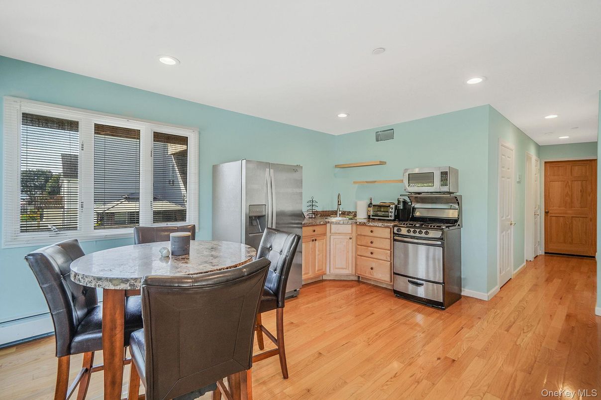Dining room, Interior, Kitchen, Recessed Lighting, Stainless Steel Appliances, Wood Texture Flooring
