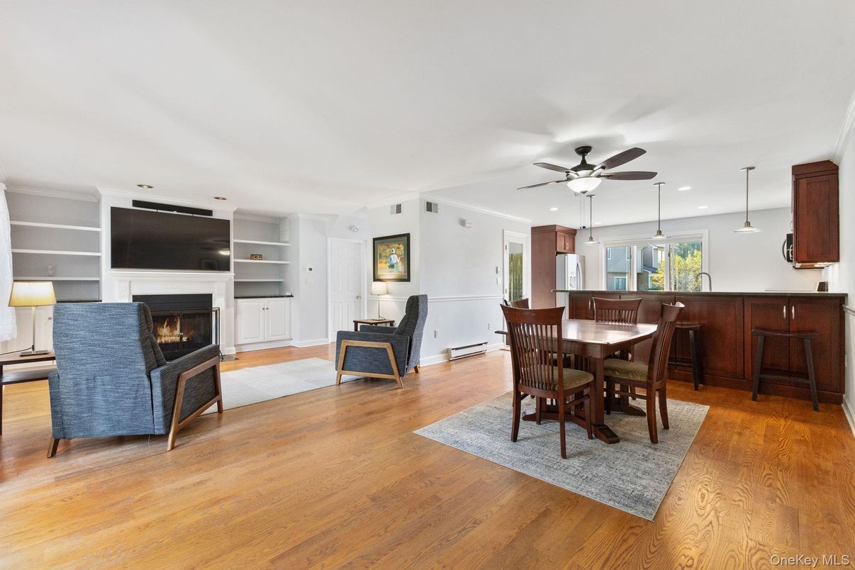 Dining room, Fireplace, Interior, Living room, Pendant Lights, Recessed Lighting, Wood Texture Flooring