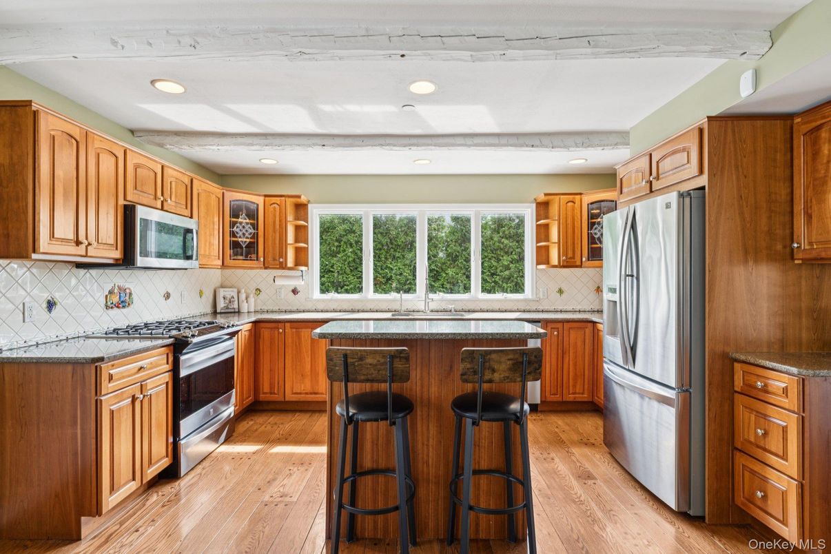 Interior, Kitchen, Recessed Lighting, Tile Countertops, Wood Texture Flooring