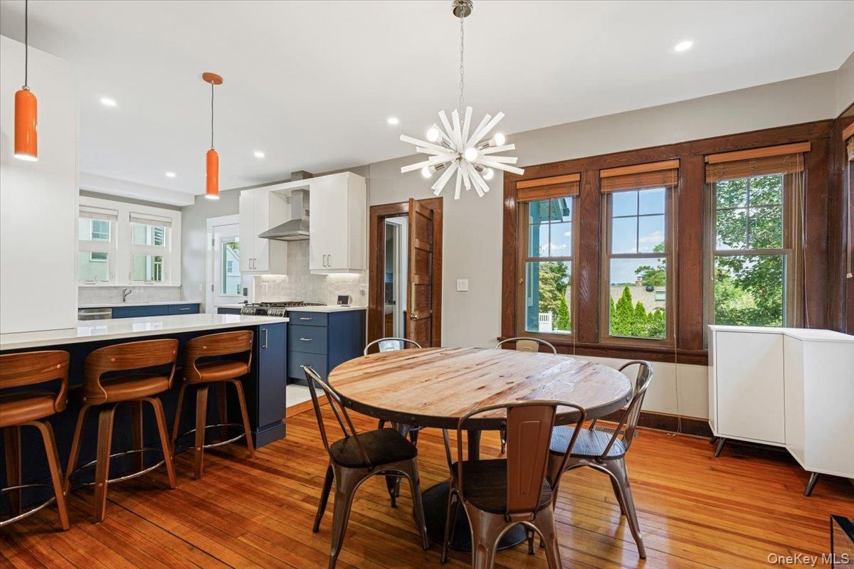 Dining room, Interior, Kitchen, Pendant Lights, Recessed Lighting, Stainless Steel Appliances, Wood Texture Flooring