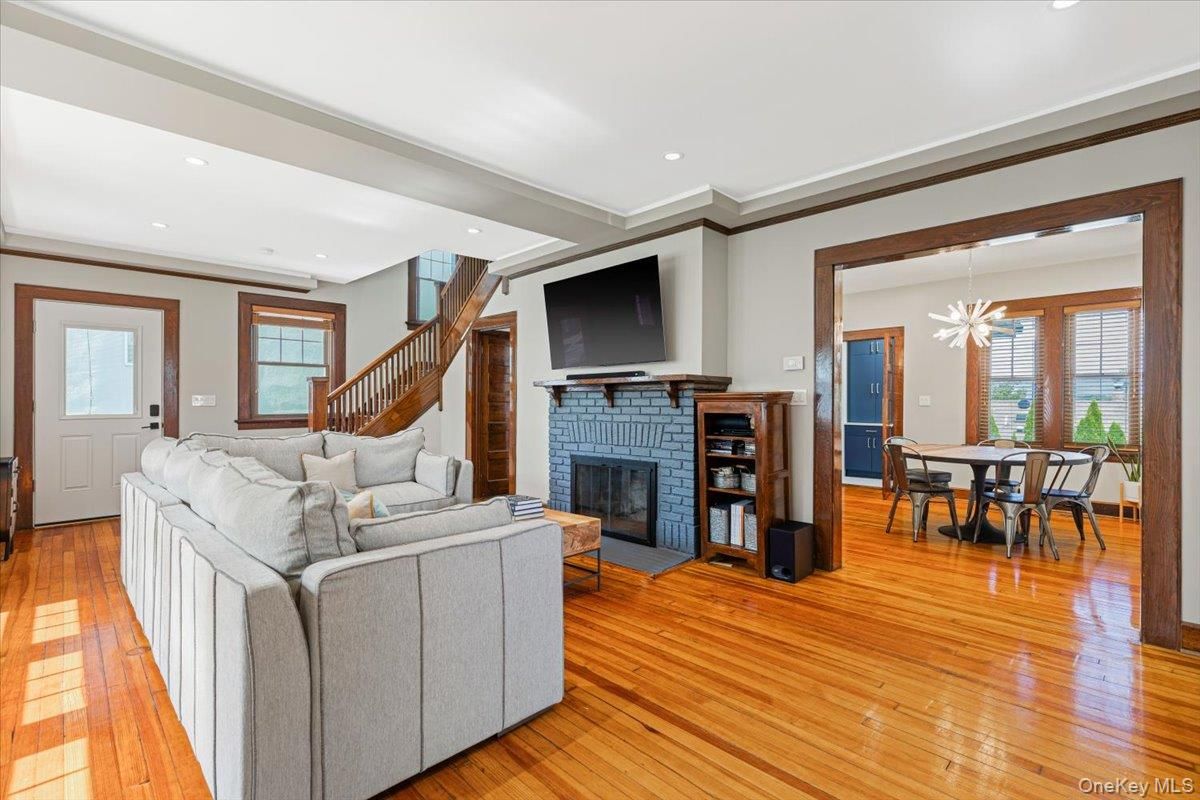 Dining room, Fireplace, Interior, Living room, Recessed Lighting, Wood Texture Flooring