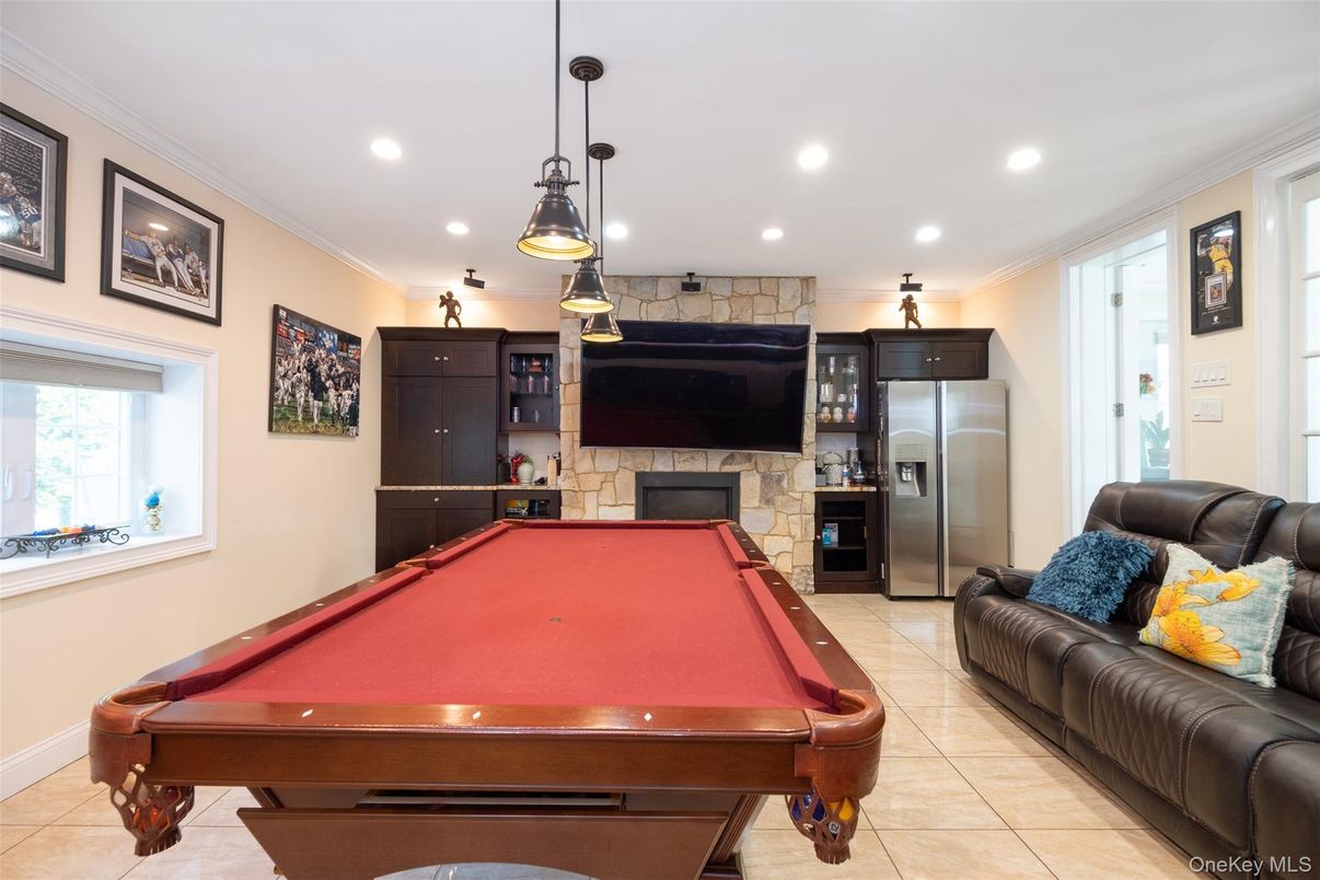 Billiard Table, Fireplace, Game Room, Interior, Pendant Lights, Recessed Lighting, Stone Walls