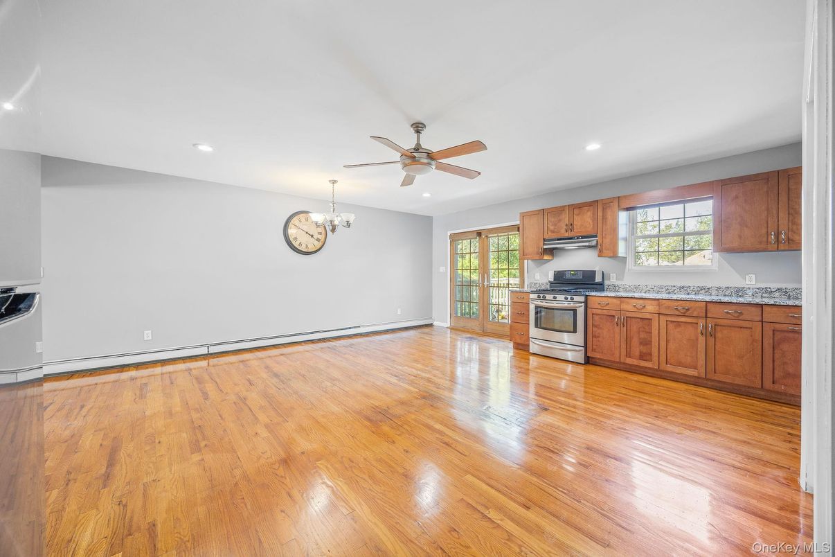 Chandelier, Empty room, Interior, Kitchen, Recessed Lighting, Stainless Steel Appliances, Wood Texture Flooring